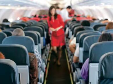 Fear of flying after plane crash – passenger with anxiety in airplane cabin
