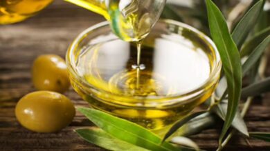 Olive oil brain health benefits shown in a bottle of extra virgin olive oil on a kitchen counter
